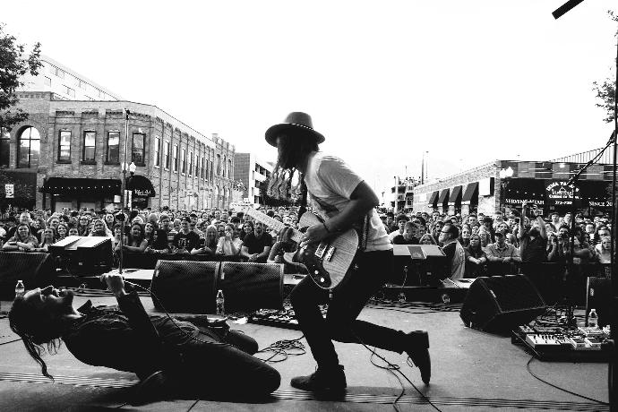 grayscale photography of concert during daytime